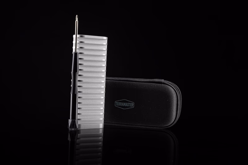 Dog grooming slicker brush and carrying case against black background